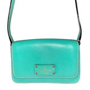 Kate Spade turquoise leather crossbody with gold-tone logo plate